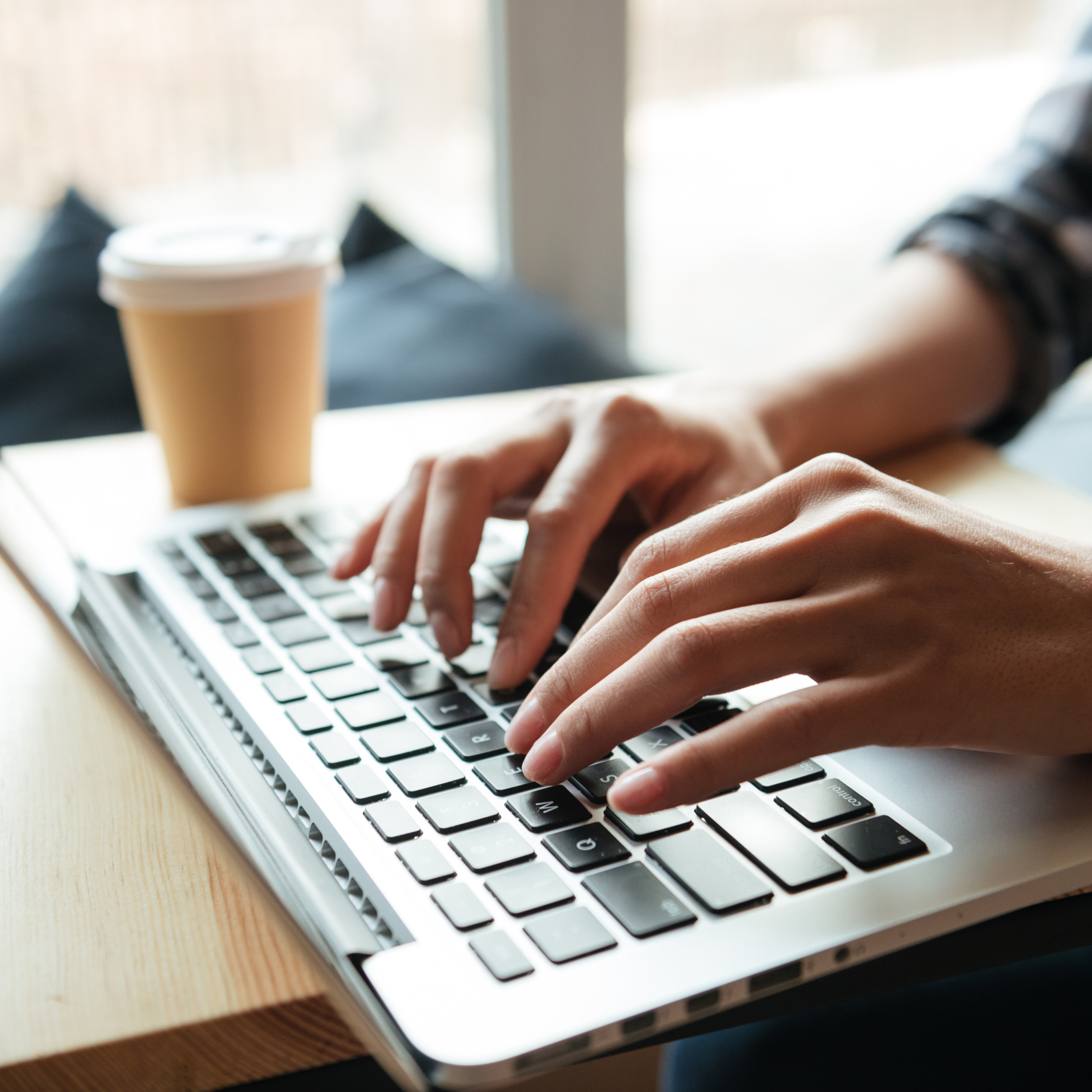 Person typing on laptop