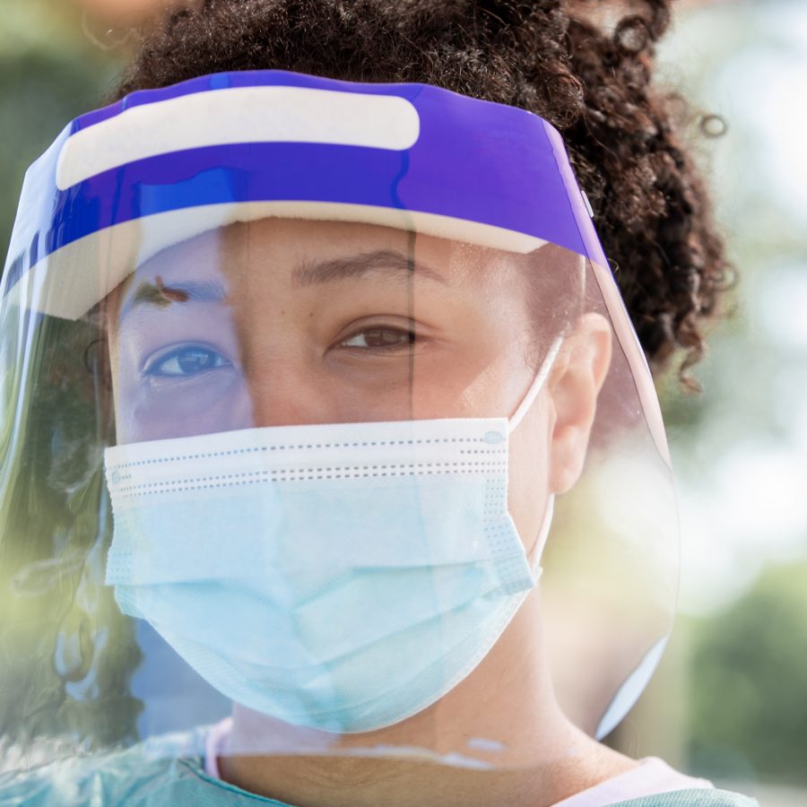 Person wearing covid mask and visor