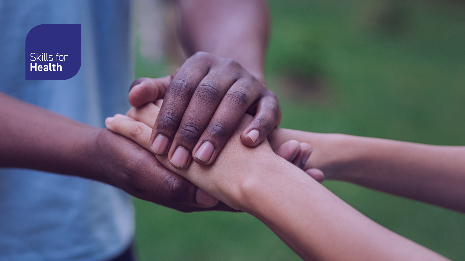holding of hands in caring manner
