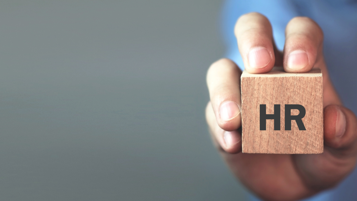 wooden block with the word HR on it