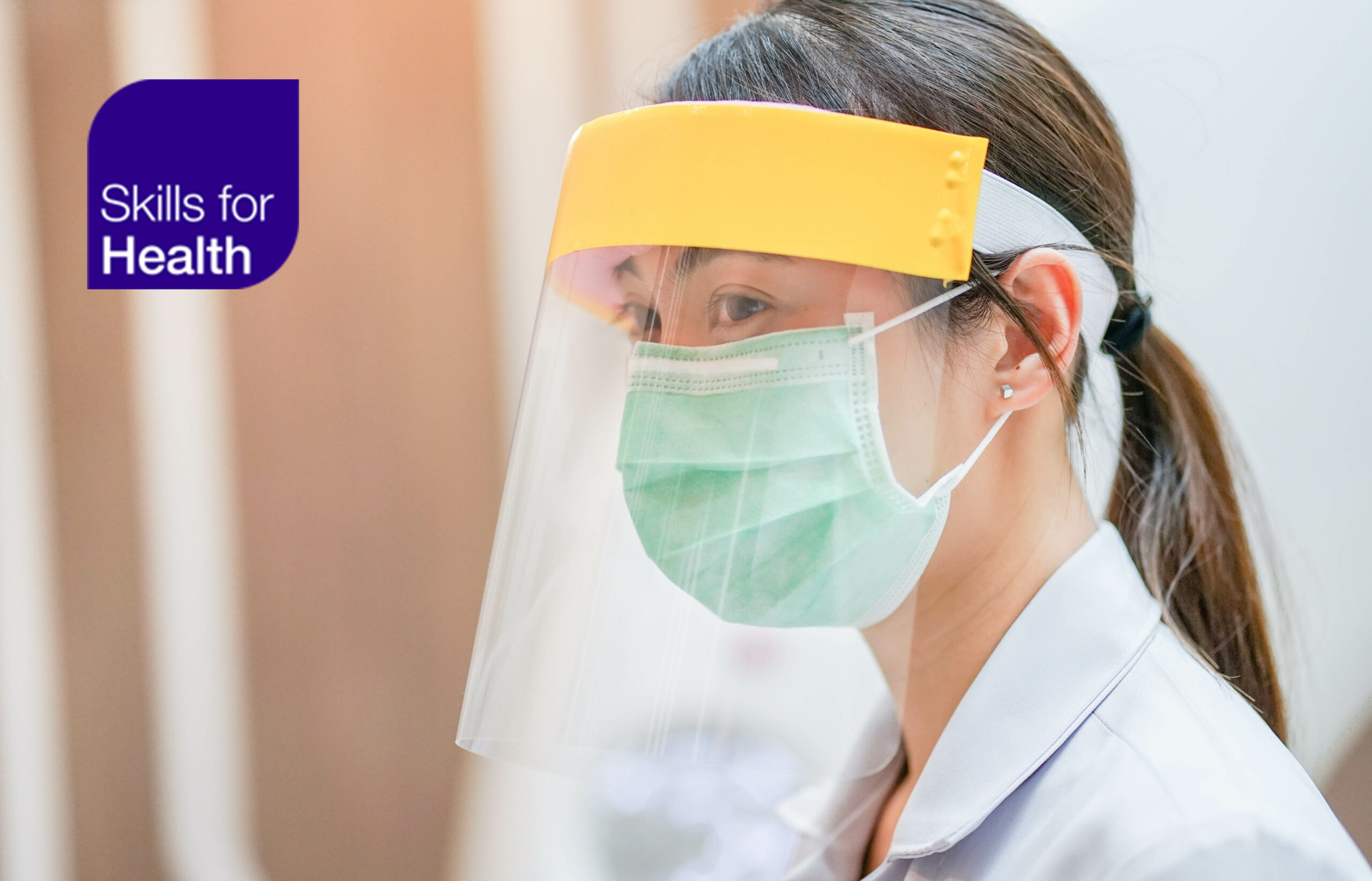 Person wearing covid mask and visor