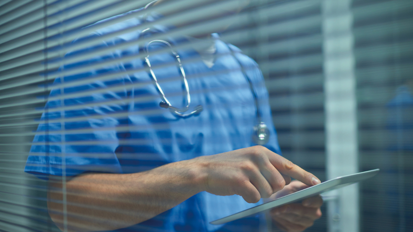 medical staff looking at tablet