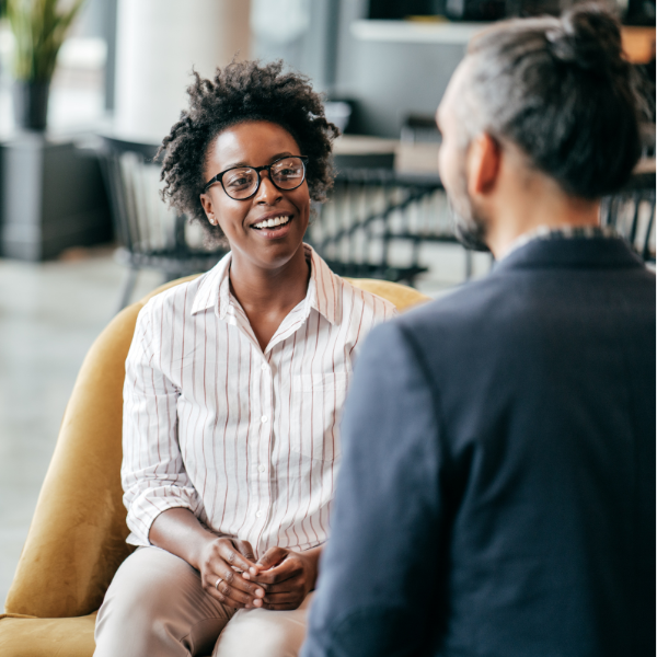 image of two people sat chatting