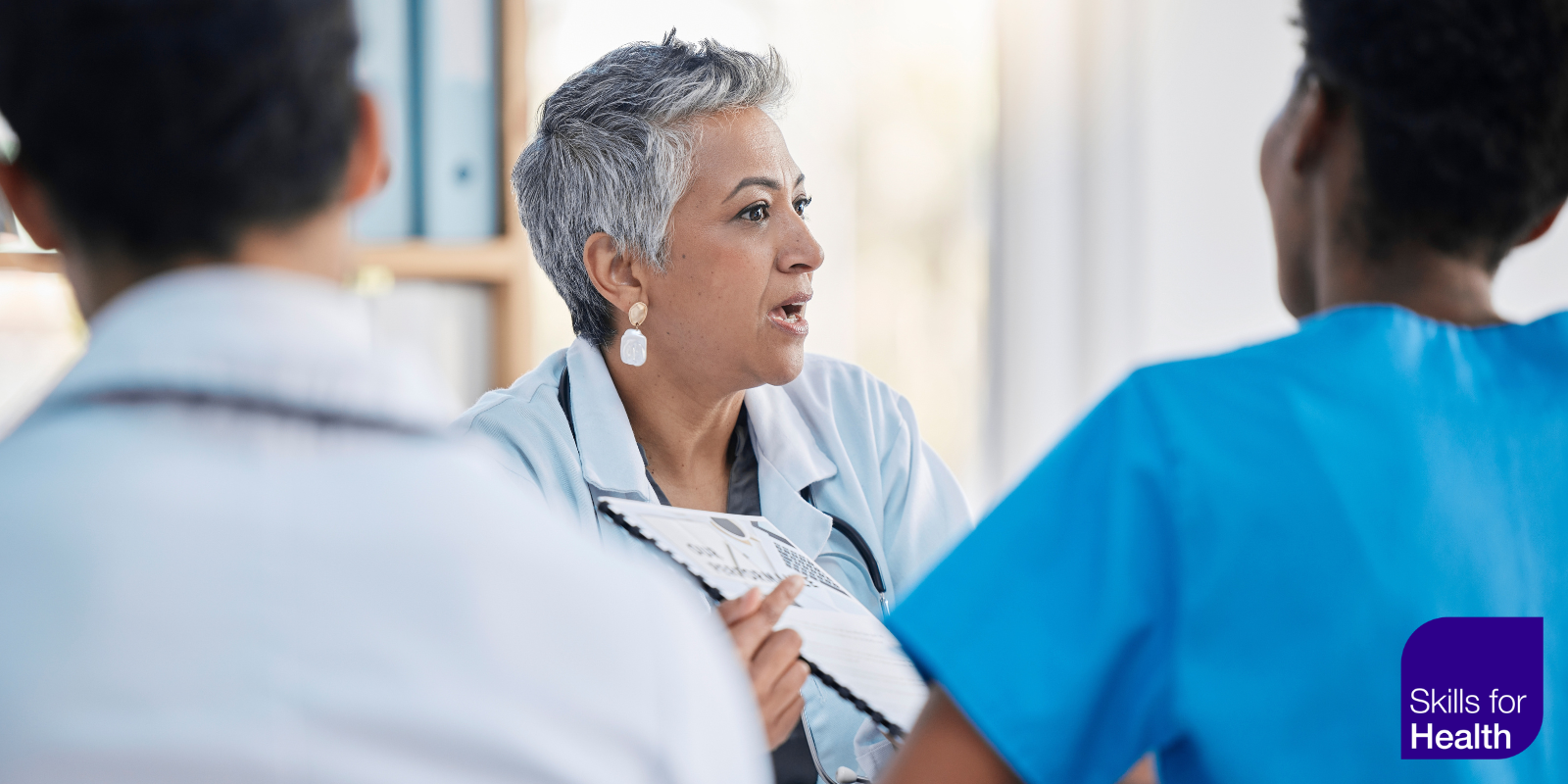 medical staff discussing a document
