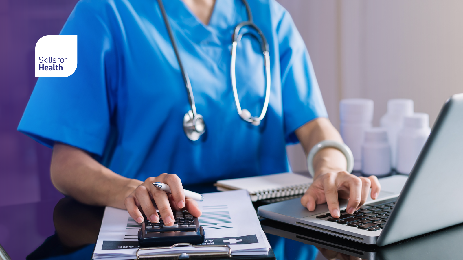 medical professional working on laptop and using a calculator