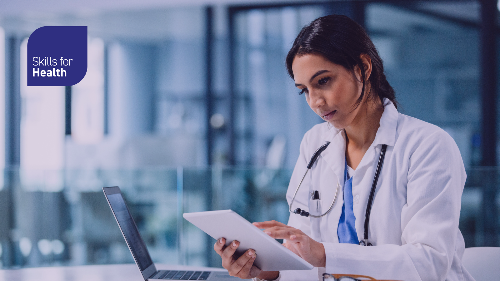 medical professional looking at tablet