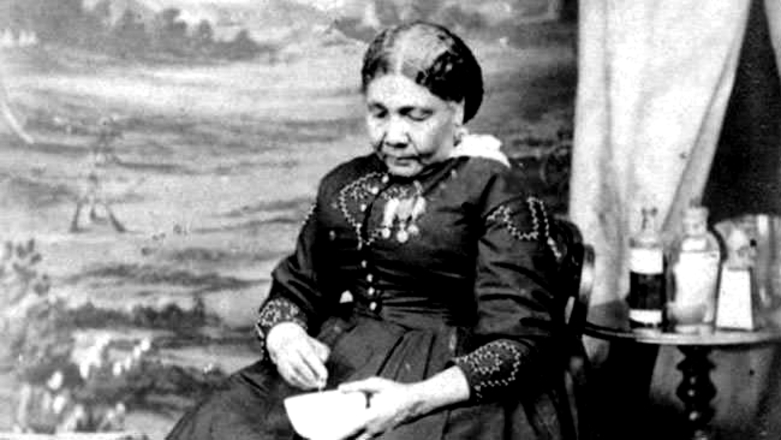 black and white vintage photo of a woman sat down