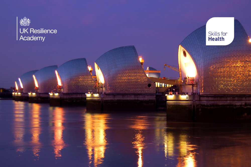 Image of buildings on waterfront with lights on, with Skills for health, and UK Resilience Academy logos