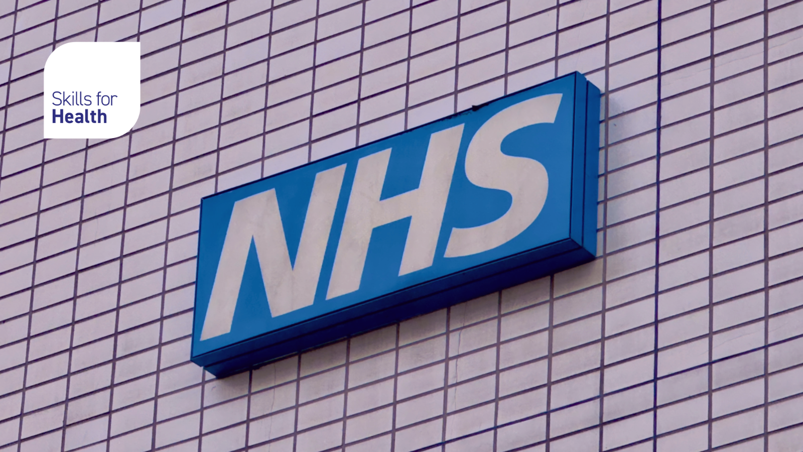 NHS logo on the outside wall of a building