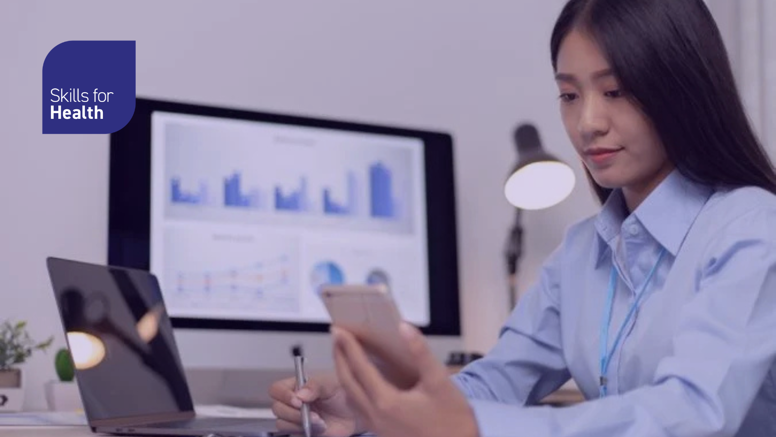 Asian female employees are analyzing market data via smartphones and have laptops to calculate the company's finances In a private office at home, Working at home and new normal concept.