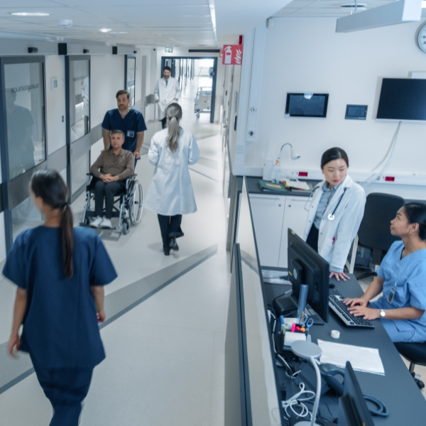 Staff and patients in hospital corridor