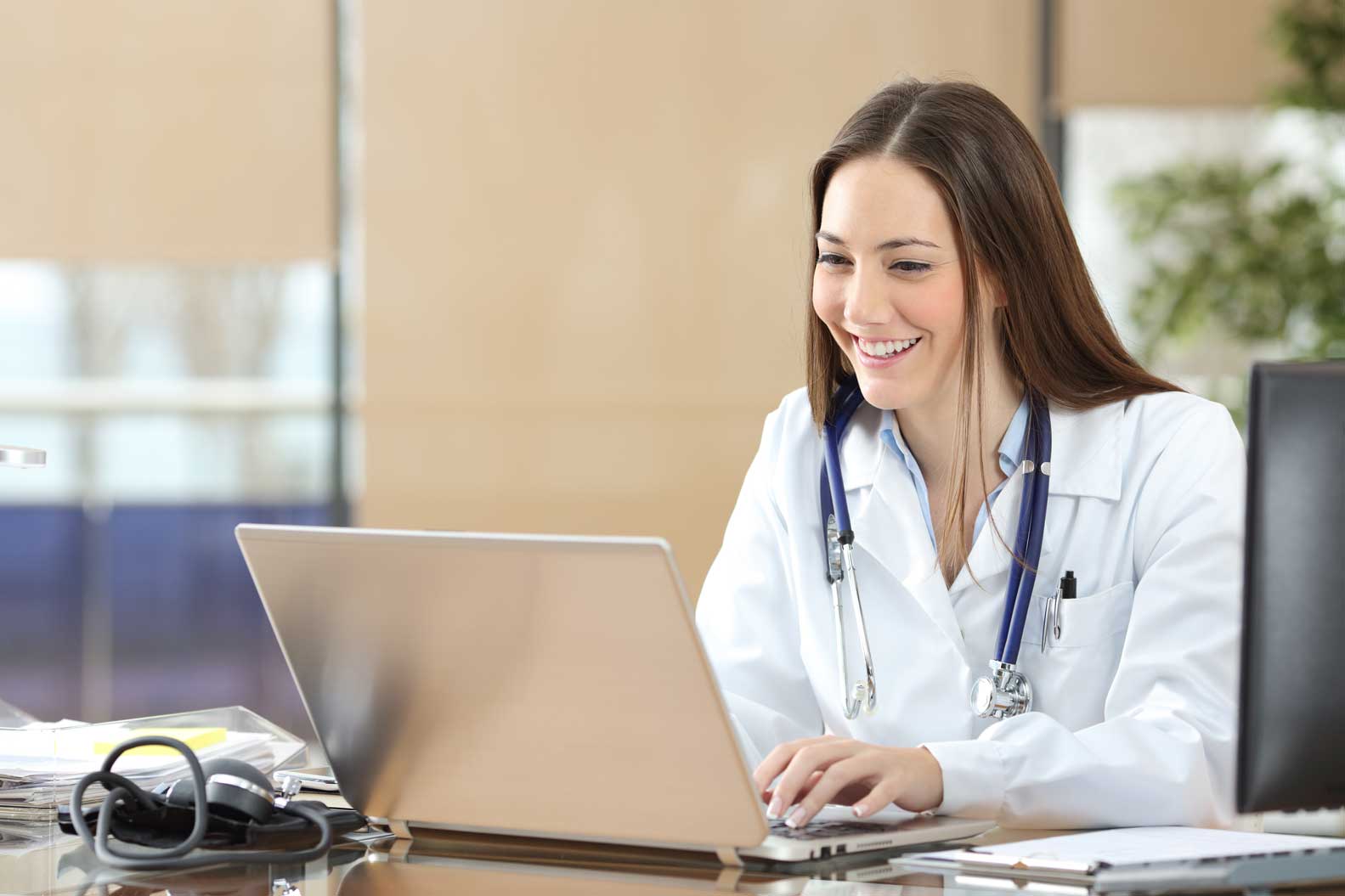 Photo of doctor at a laptop