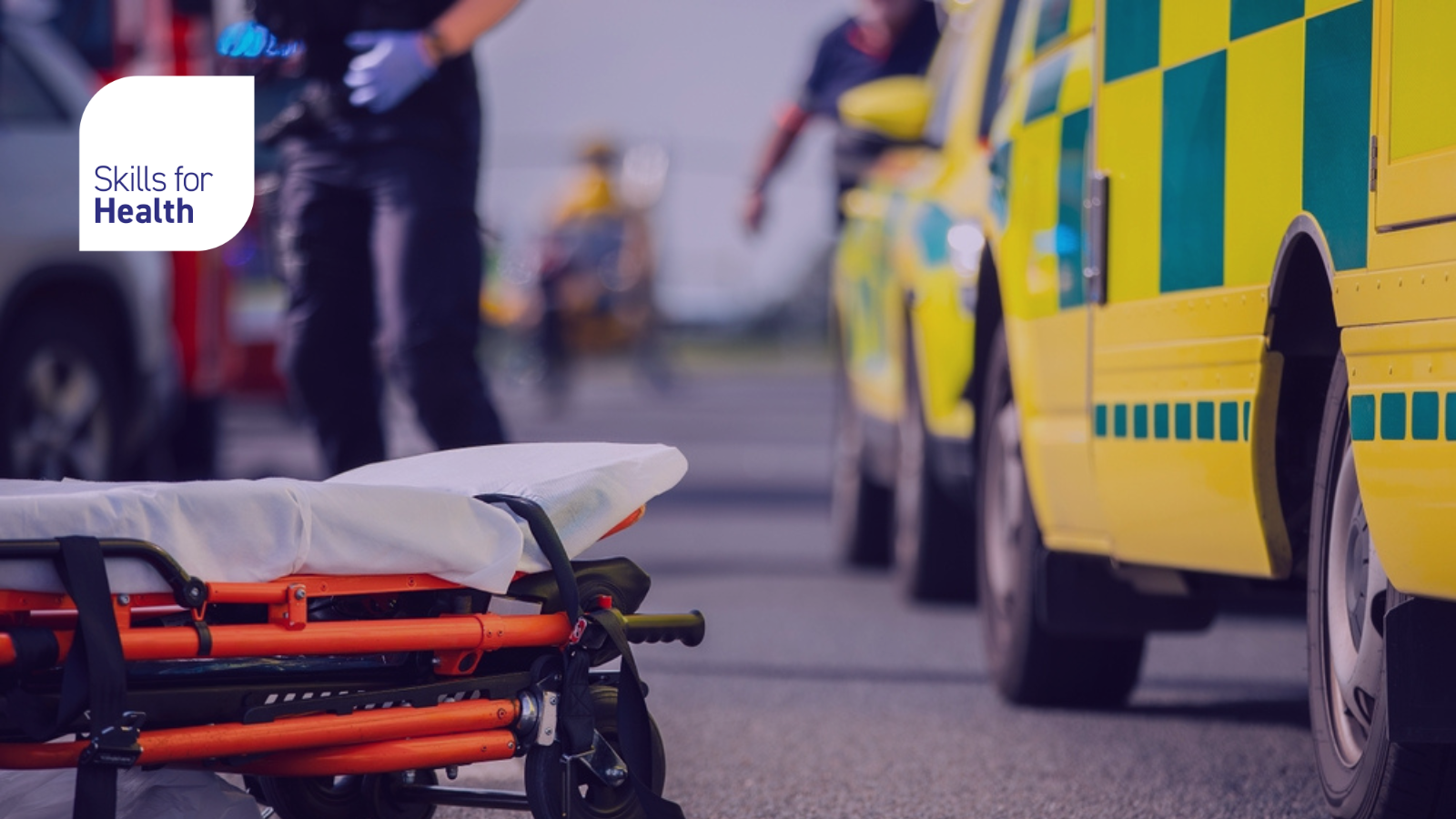 Selective focus on stretcher against ambulance cars of emergency medical service, firefighters and rescue helicopter on road. Themes rescue, urgency and health care.