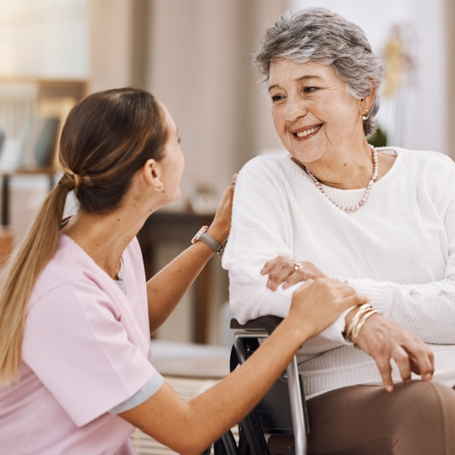 Wheelchair disability, rehabilitation and nurse volunteer at nursing home for charity work. Healthcare, support and caregiver with senior women for medical help, elderly care and consulting patient